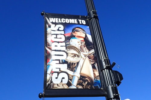 Banner of female motorcycle rider along the street in Sturgis