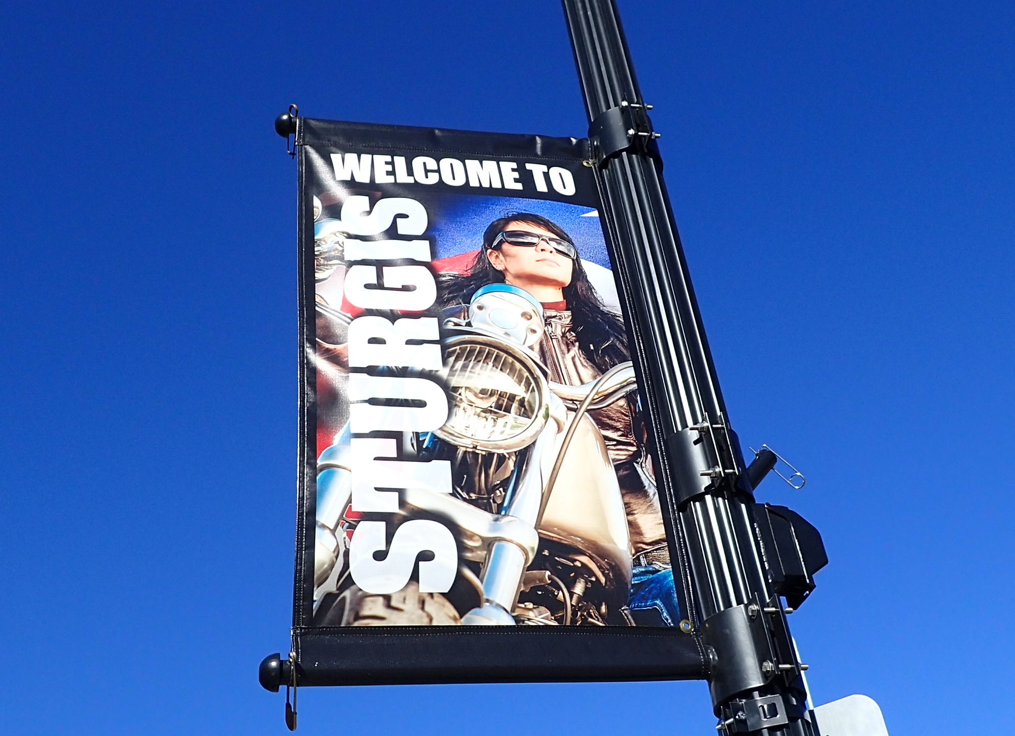 Banner of female motorcycle rider along the street in Sturgis