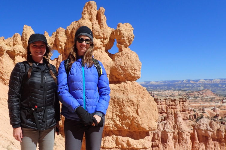Maria and Kelly 1 on the edge of Bryce Canyon National Park amphitheater with hoodoos in the background